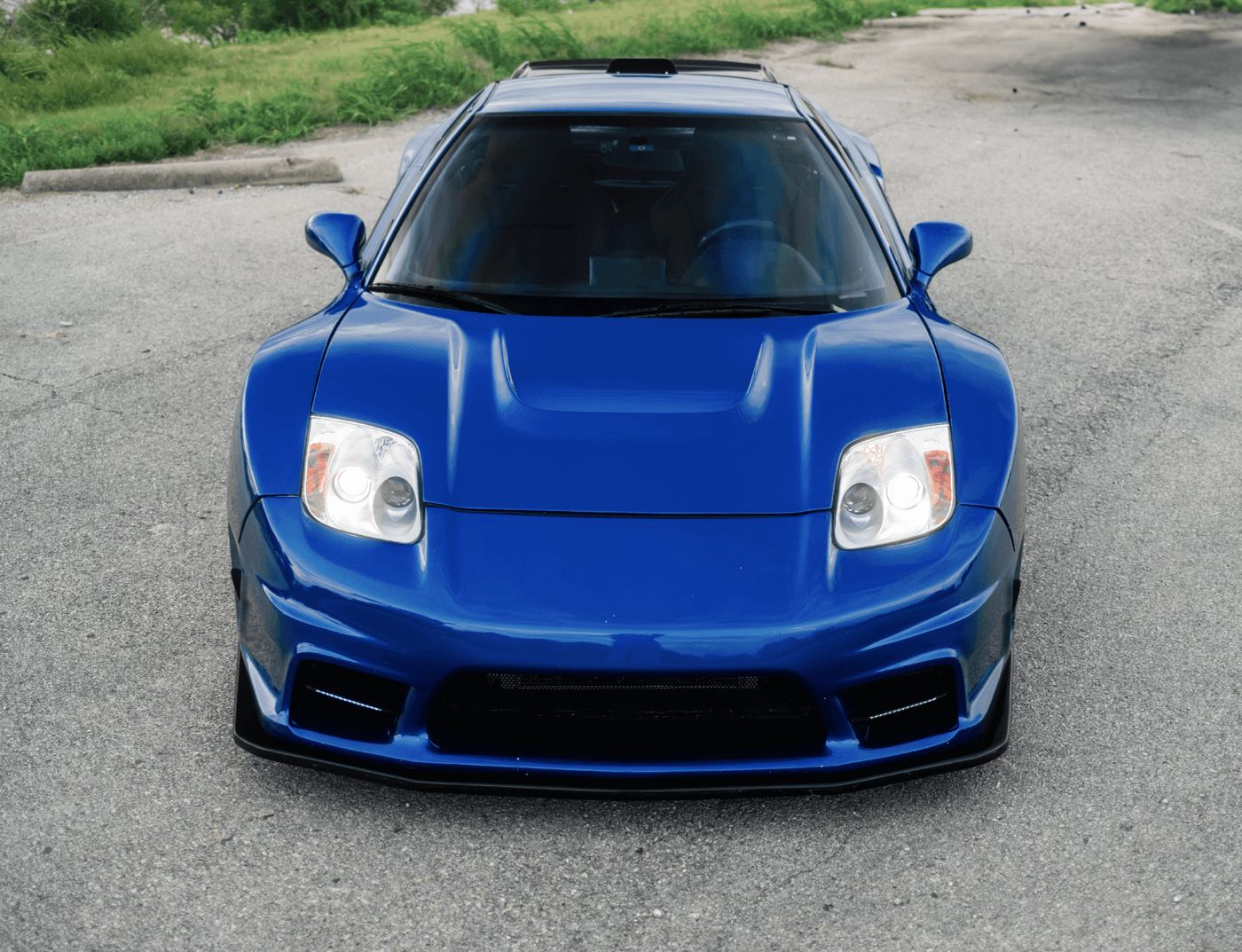 Head-on view of the NSX with NSX-R-style hood and fixed headlights