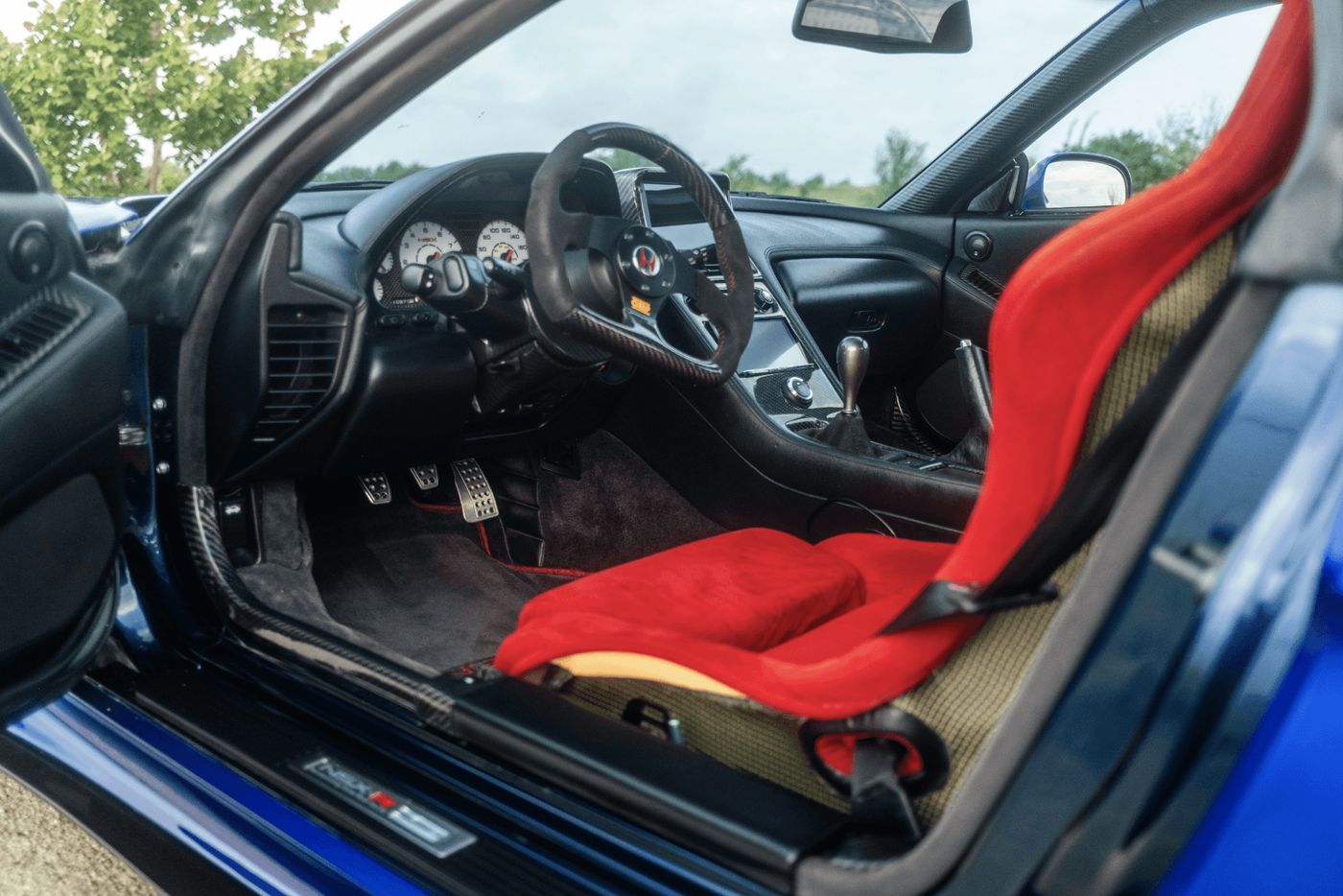 NSX cabin with red microsuede carbon-kevlar bucket seat
